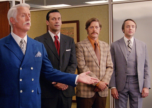 John Slattery as Roger Sterling, Jon Hamm as Don Draper, Kevin Rahm as Ted Chaough, and Vincent Kartheiser as Pete Campbell in Mad Men.