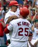 Mark McGwire and his son Matt celebrate No. 61