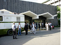 Journalists hang around outside the Kabul Inter-Continental Hotel