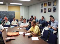 Half of the people who came to the muon meeting (Michael, at table in front)