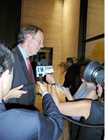 New York Gov. George Pataki with reporters after his address