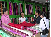 June Shih (in the white T-shirt) and friends shop for brocade