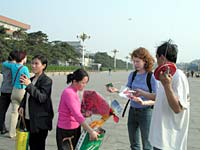 Emma surrounded by kite-sellers