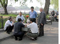 Old folks playing cards in Houhai
