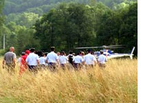 Lance Armstrong, surrounded by police, leaves by helicopter