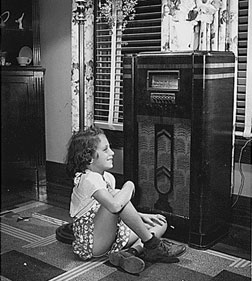 1_123125_123019_2207910_2224162_090803_pb_radiotn A girl listening to the radio during the Great Depression. Click image to expand.