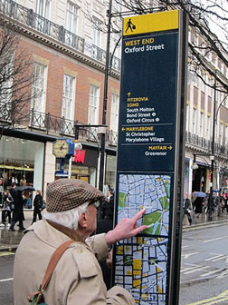 People in Mayfair using Legible London signs. Click image to expand.