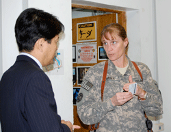 Lt. Col. Kimberly Johanek talks to  Hai-Kwang Lee, deputy chief of mission for the Korean Embassy. Click to expand image. 