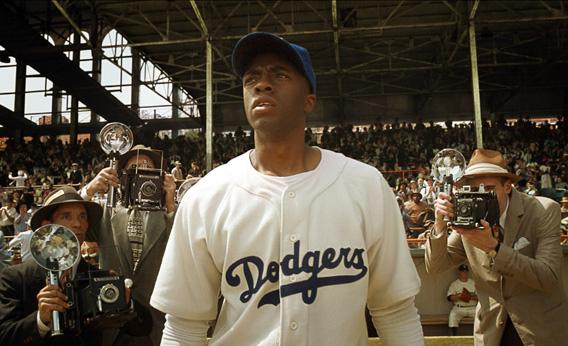 Chadwick Boseman as Jackie Robinson in 42