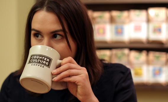 2012 U.S. Barista champion Katie Carguilo tastes her own fresh-made coffee at Counter Culture Coffee