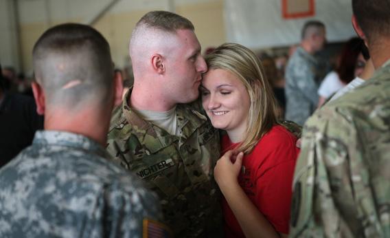 Soldiers from the 713th Engineer Company of the Indiana Army National Guard are greeted by family.