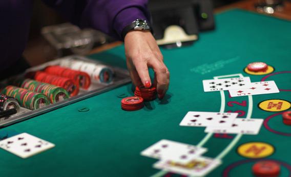 A dealer works the blackjack table.