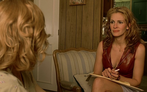 Julia Roberts as Erin Brockovich.