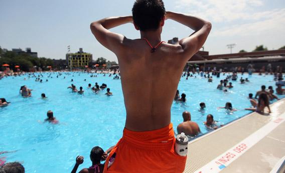 A lifeguard keeps watch on opening day of the newly renovated McCarren Park Pool on June 28, 2012, in Brooklyn, New York.