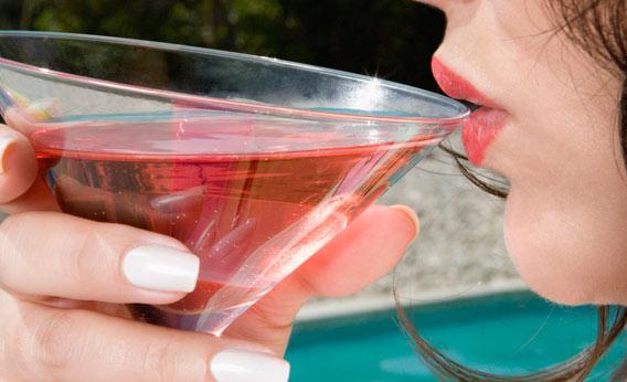 Woman drinking Cosmo.