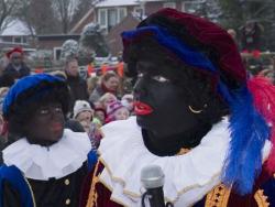 Two men dressed as Zwarte Piet for the Dutch celebration of Sinterklaas.