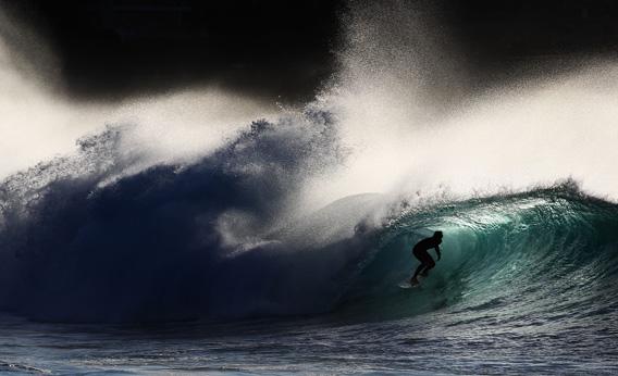 A surfer rides a wave while surfing at Bronte Beach on May 8, 2012 in Sydney, Australia. 