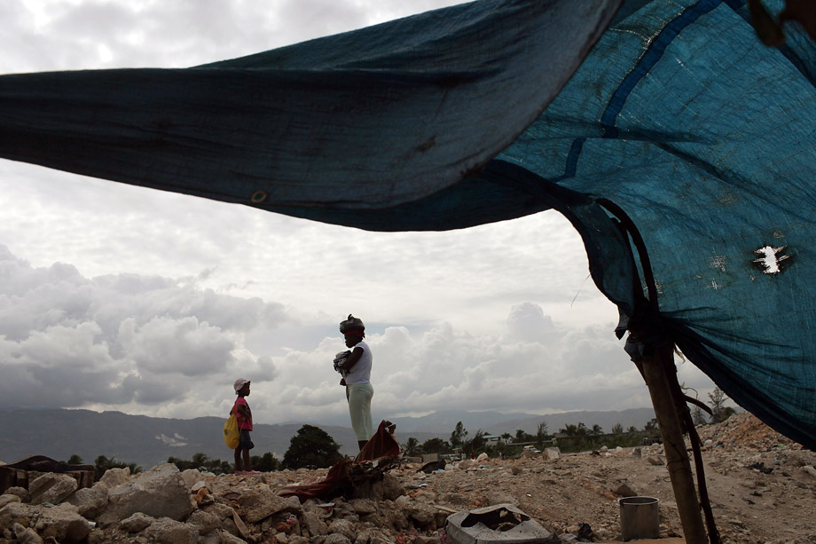 People stand in a tent camp for individuals who lost their homes in the Jan. 12 earthquake, Nov. 3, 2010 in Port-au-Prince, Haiti. More than 1 million Haitians are refugees due to the January's earthquake. Haiti, one of the poorest nations in the Western Hemisphere, has been further unsettled by an outbreak of cholera, which has so far killed more than 330 people. 