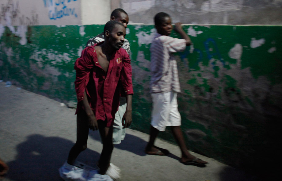 A Haitian with cholera arrives to receive treatment at St.-Catherine hospital in the slum of Cite-Soleil in Port-au-Prince, Nov. 19, 2010. The United Nations-led international response to Haiti's deadly cholera epidemic is "inadequate" and woefully short of funding and aid groups, including the U.N. humanitarian agency.