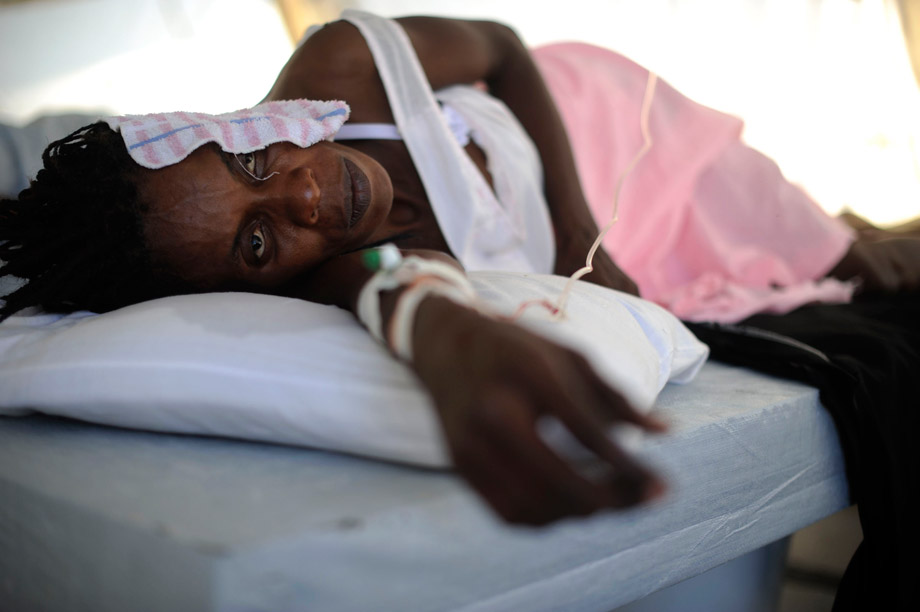 A woman infected with cholera receives treatment in a clinic set up by the aid agency Doctors Without Borders, Port-au-Prince, Haiti, Nov. 26, 2010. 