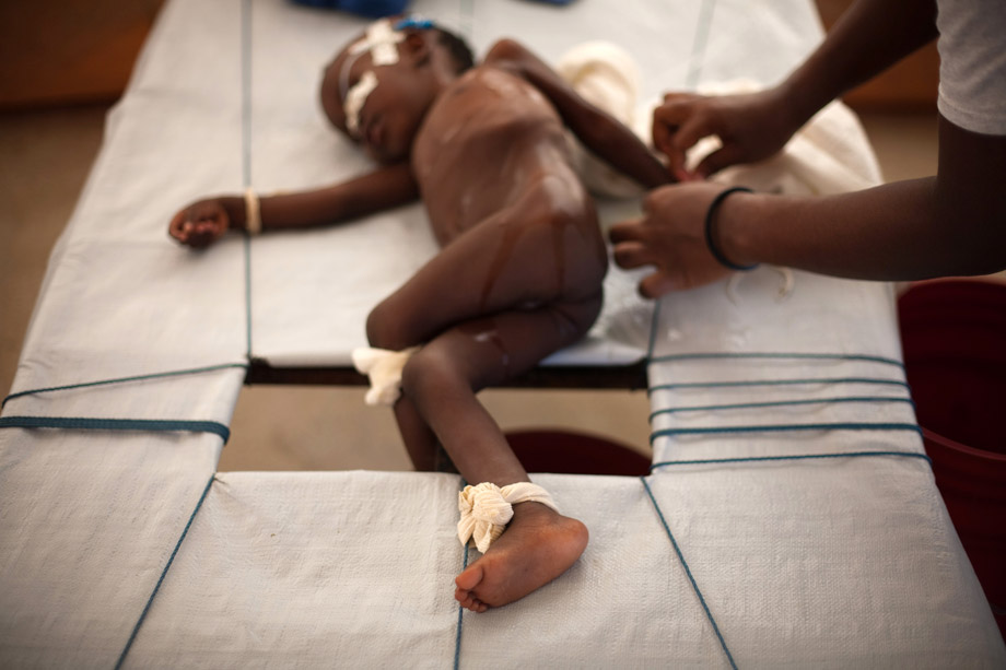 A boy with cholera is unstrapped from his bed during treatment at a cholera clinic set up by Doctors Without Borders in the Tabarre neighborhood of Port-au-Prince, Nov. 19, 2010.