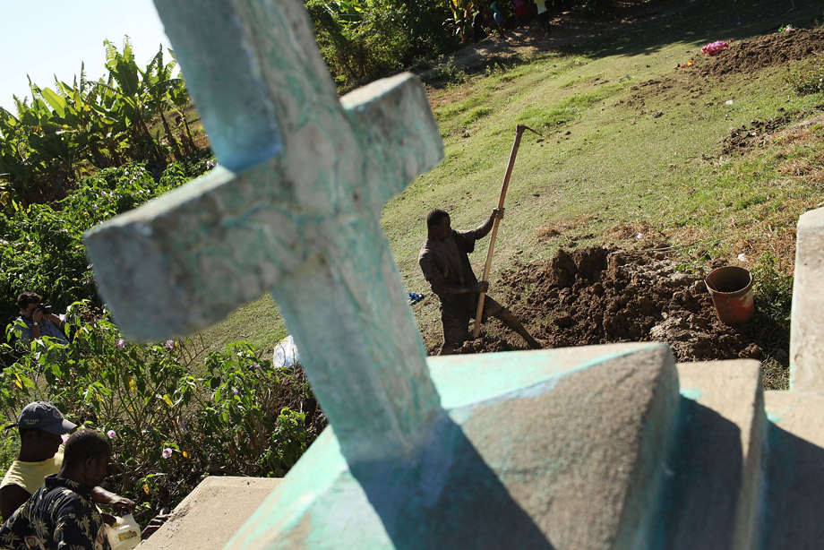 130225_FOR_cholera18 Cemetery workers cover the grave of Serette Pierre, who recently died of cholera, Oct. 29, 2010, in Back D' Aguin, Haiti. Pierre died the same day she contracted cholera, leaving three children without parents. Haiti, one of the poorest nations in the western hemisphere, has been further unsettled by an outbreak of cholera, which has so far killed over 300 people. The epidemic has affected the central Artibonite and Central Plateau regions with 3,612 cases so far on record. Authorities believe the outbreak is contained, but has not yet peaked. There is also fear that the deadly diarrheal disease could migrate to the sprawling camps for the hundreds of thousands of Haitians displaced by the January 2010 earthquake.