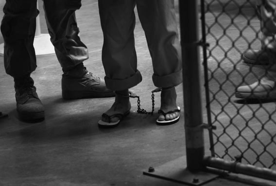 A &quot;non-compliant&quot; detainee is escorted by guards after showering inside the U.S. military prison for &quot;enemy combatants&quot; on October 27, 2009 in Guantanamo Bay, Cuba.