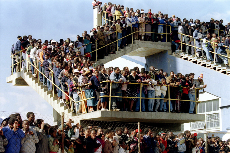 Thousands of people listen to President Nelson Mandela at a stadium in Lesotho's capital on July 13 