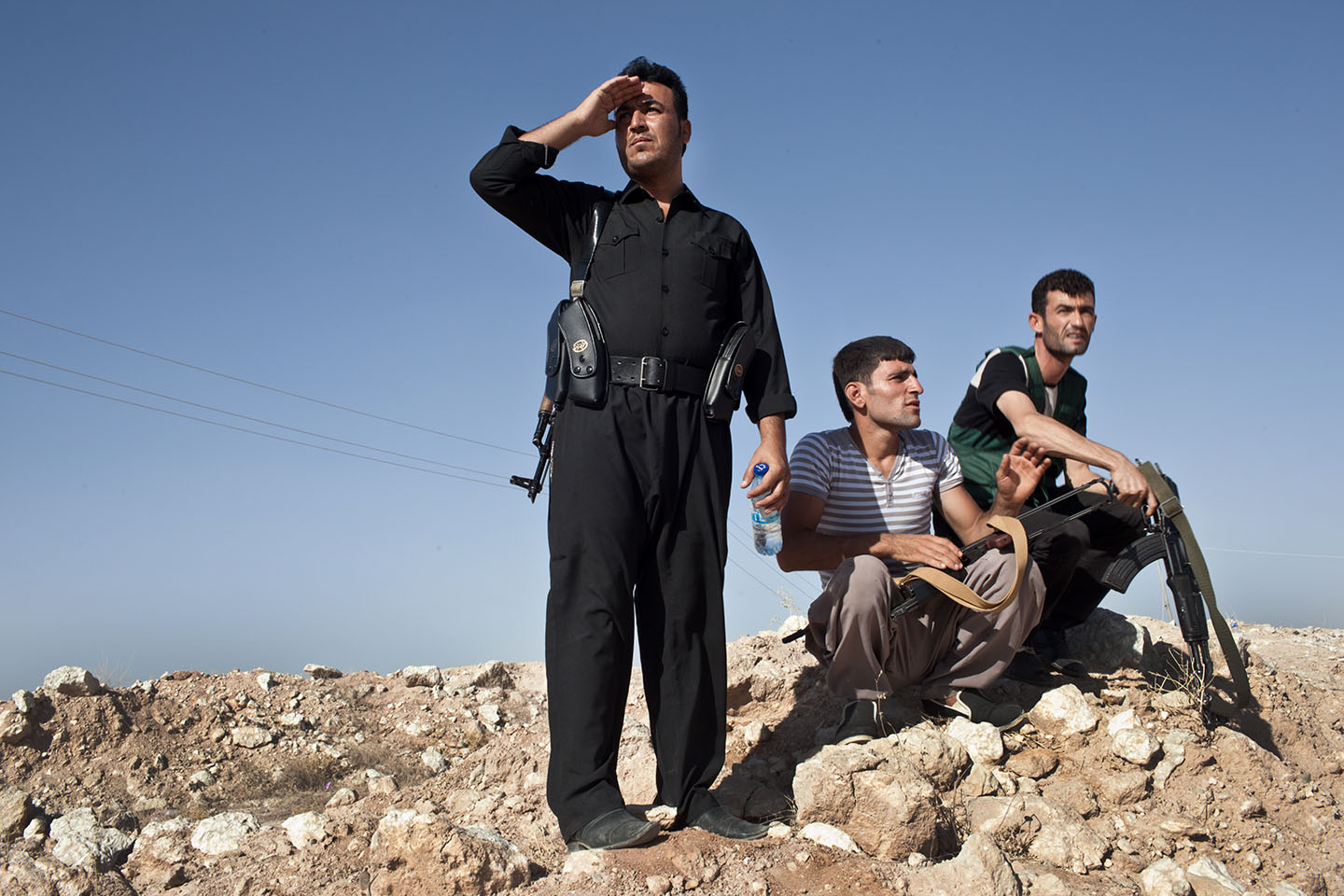 Kurdish military volunteers amass near the frontline on the outskirts of the town of Makhmor, 35 miles south of Irbil, the capital of the Kurdish Region of Iraq (KRI), on August 9, 2014.
