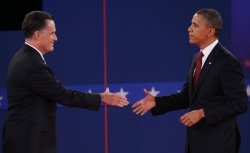 Mitt Romney and Barack Obama shake hands before debating.