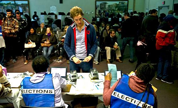 People check in to cast their ballots at an early voting center in Washington on November 2, 2012, four days before the official polling day in the US presidential election.