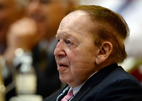 Las Vegas Sands Corp. CEO Sheldon Adelson listens to New Jersey Gov. Chris Christie.