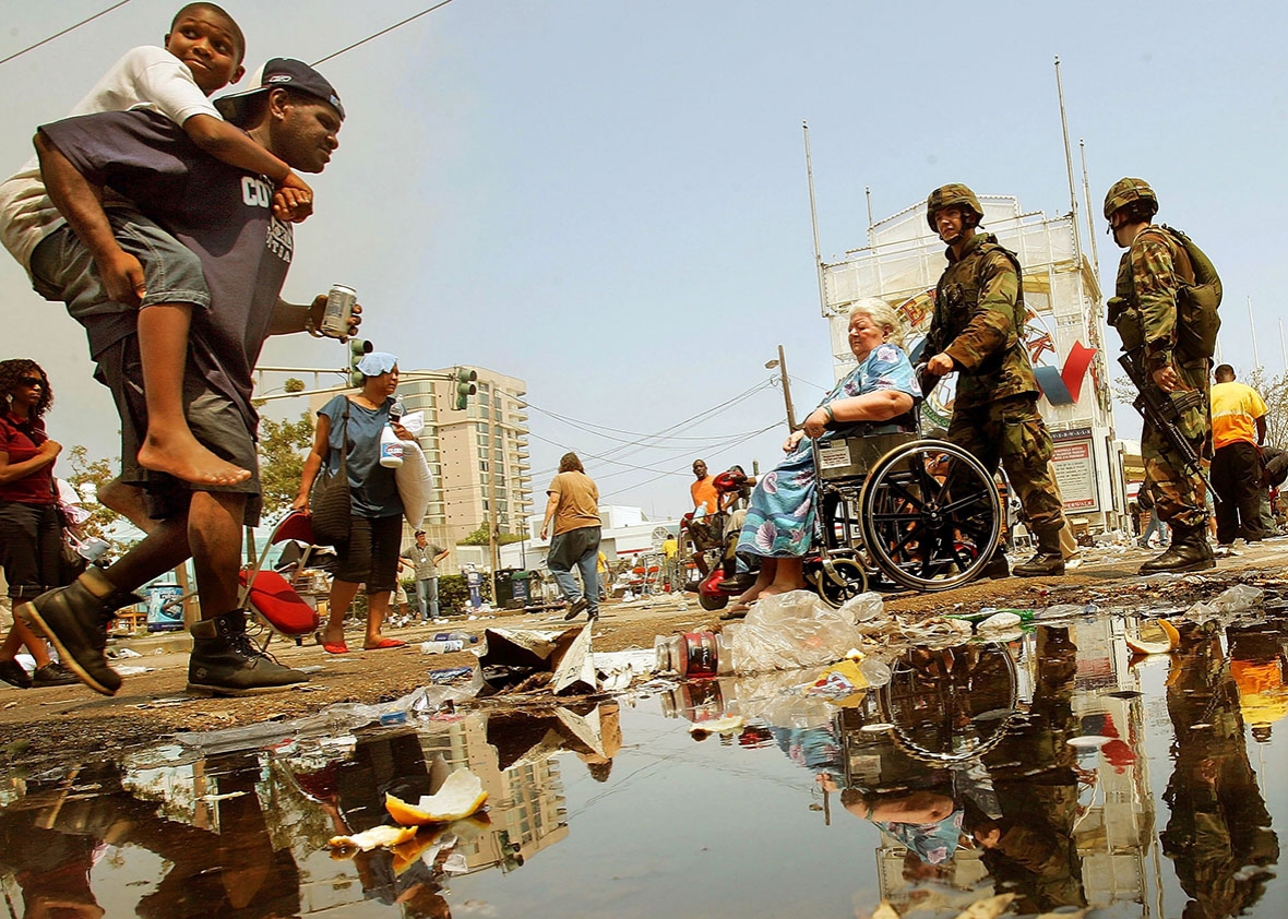 150828_POL_KatrinaMyth_streetarmy U.S. Army National Guard soldiers assist stranded victims of Hur