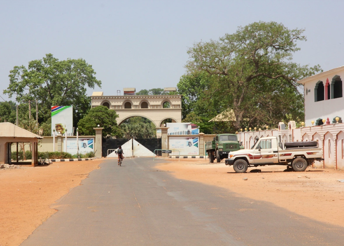 Yahya Jammeh’s palace gates at the end of the main road leading into Kanilai Yahya Jammeh’s palace gates at the end of the main road leading into Kanilai
