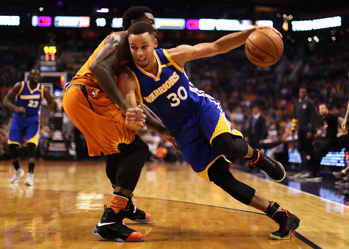 Stephen Curry #30 of the Golden State Warriors handles the ball under pressure from Eric Bledsoe #2 of the Phoenix Suns during the first half of the NBA game at Talking Stick Resort Arena on October 30, 2016 in Phoenix, Arizona. 