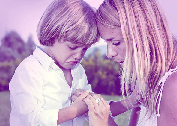 Crying young boy with finger injury