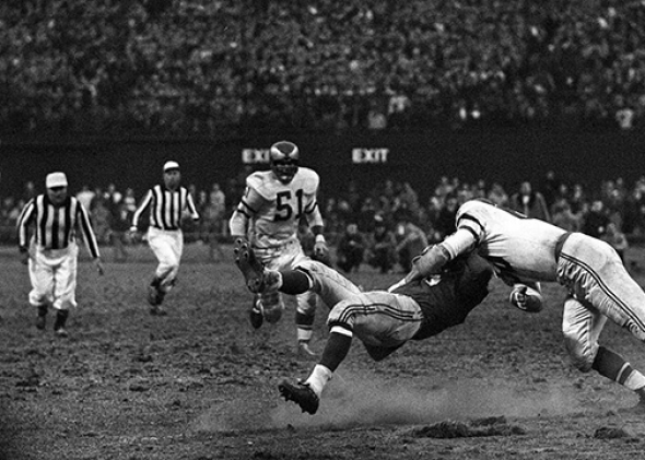 Linebacker Chuck Bednarik #60 (right), of the Philadelphia Eagle,Linebacker Chuck Bednarik #60 (right), of the Philadelphia Eagles, hits Frank Gifford #16 (center), of the New York Giants