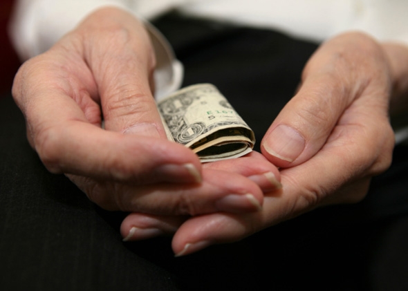 Senior citizen counting money.