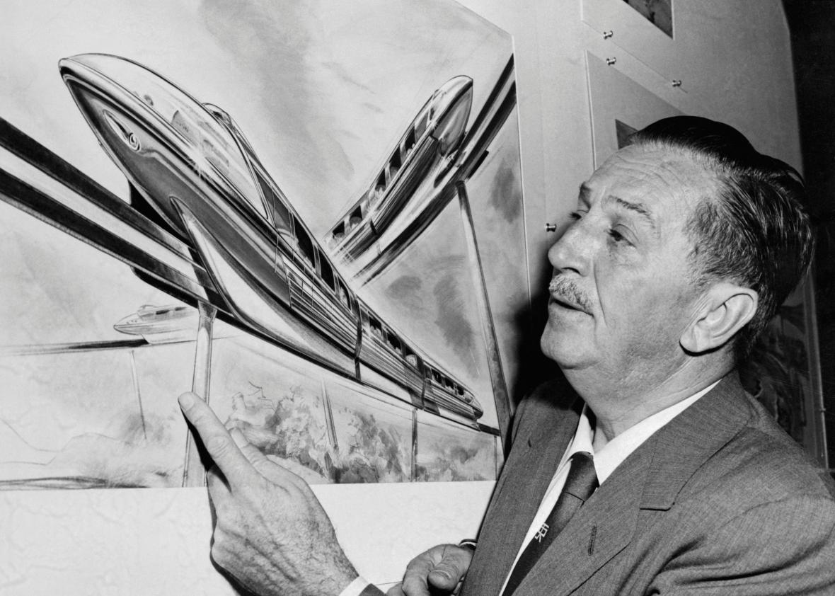 gettyimages517250082 Walt Disney examines an artist's drawing of the futuristic Monorail system which will be in operation at Disneyland.