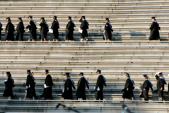 Graduating students enter the Paladin stadium before U.S. President George W. Bush watches them during the commencement ceremony at Furman University in Greenville, South Carolina May 31, 2008.