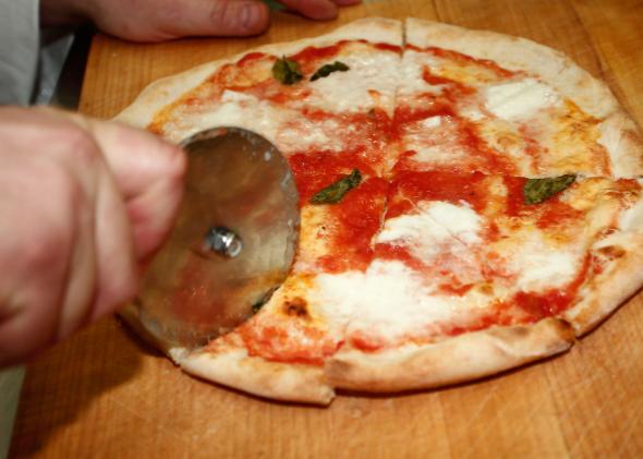 108007364-pizza-making-is-demonstrated-during-the-international