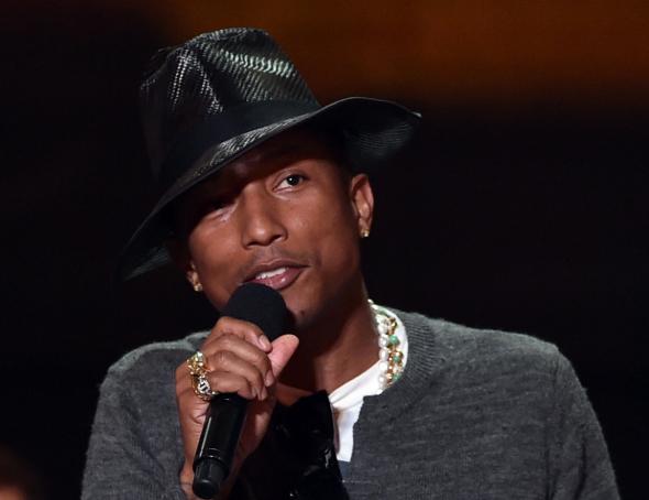 487676799-musician-pharrell-williams-speaks-onstage-during-the