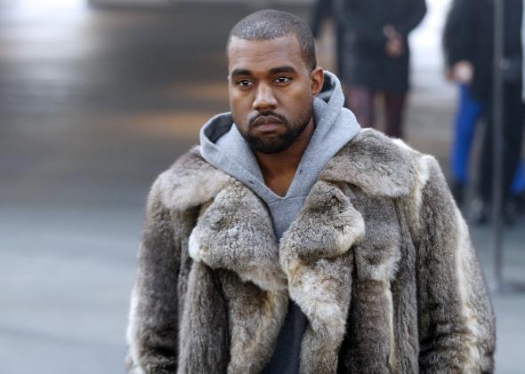 463224281-musician-kanye-west-arrives-to-attend-givenchys-fall