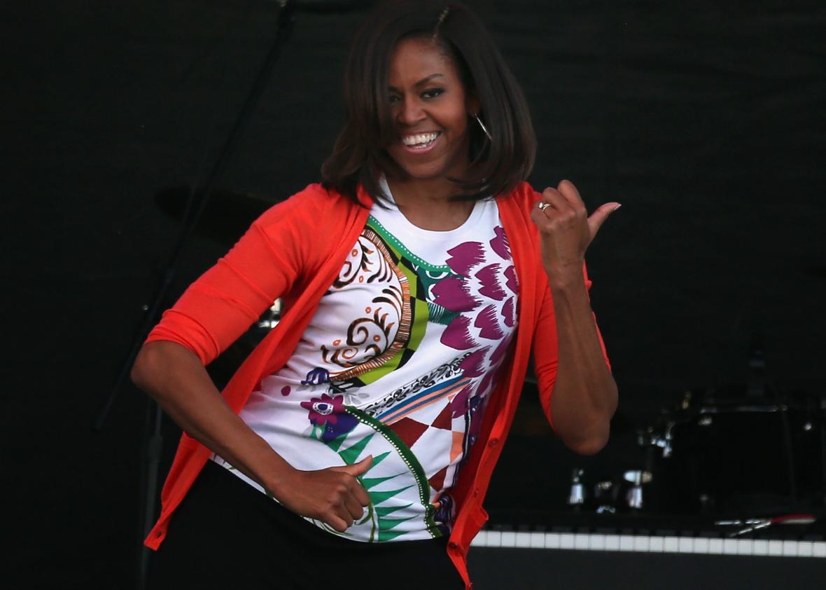 468741734-first-lady-michelle-obama-dances-with-members-of-the