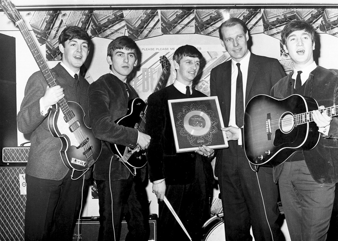 The Beatles with George Martin, circa 1964.