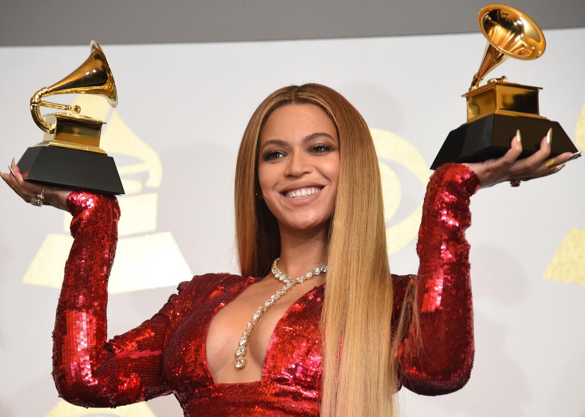 635010804-singer-beyonce-poses-with-her-grammy-trophies-in-the