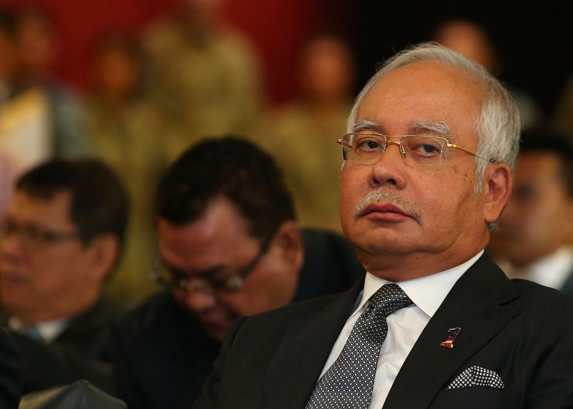 482087699-malaysian-prime-minister-najib-razak-looks-on-as-air