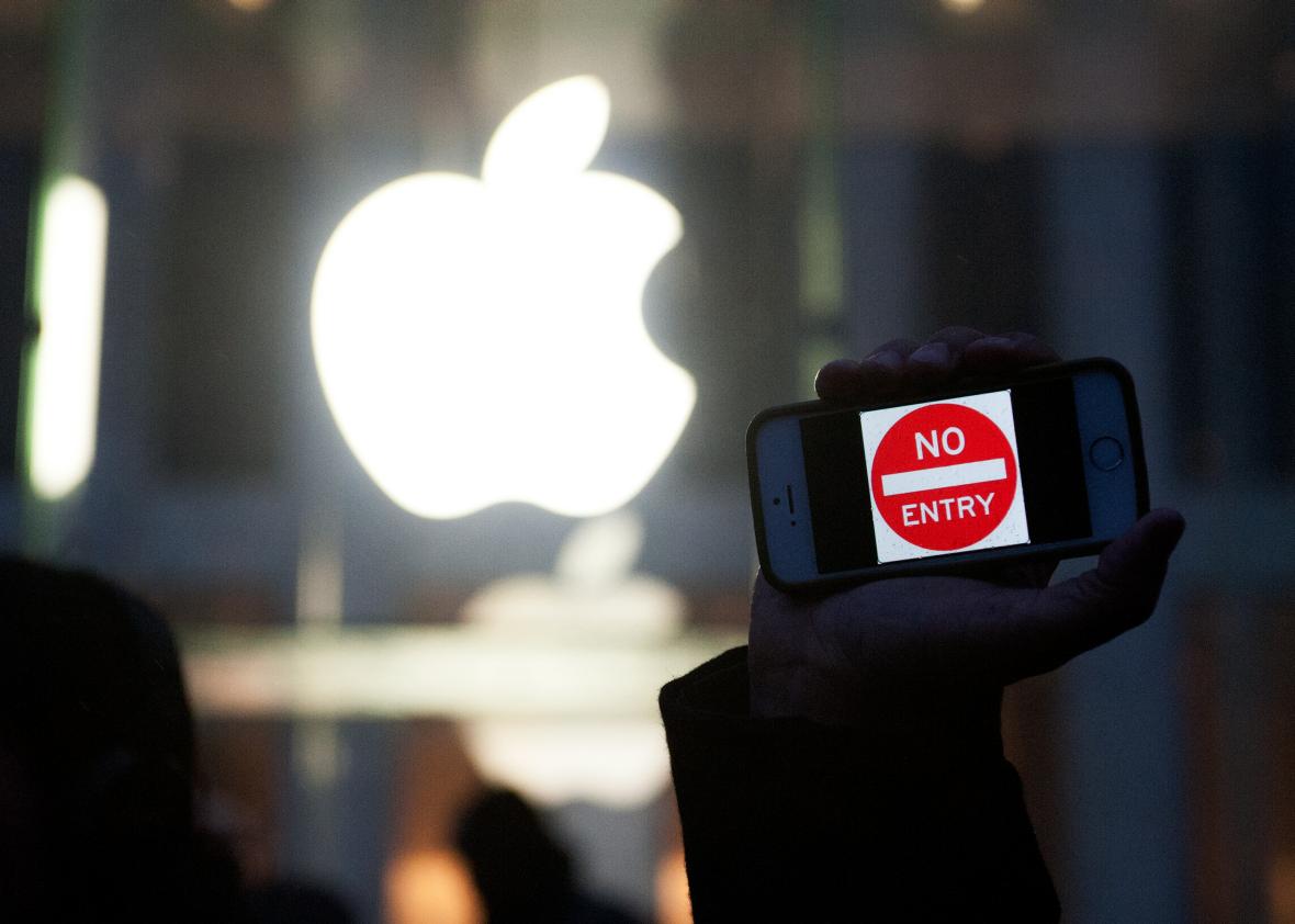 511899854-protestor-holds-up-an-iphone-that-reads-no-entry