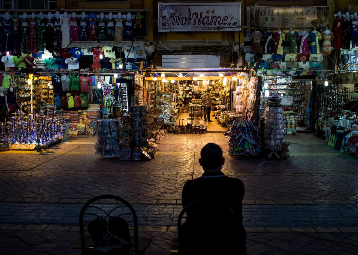519095030-shop-owner-waits-for-customers-in-the-old-market 519095030-shop-owner-waits-for-customers-in-the-old-market