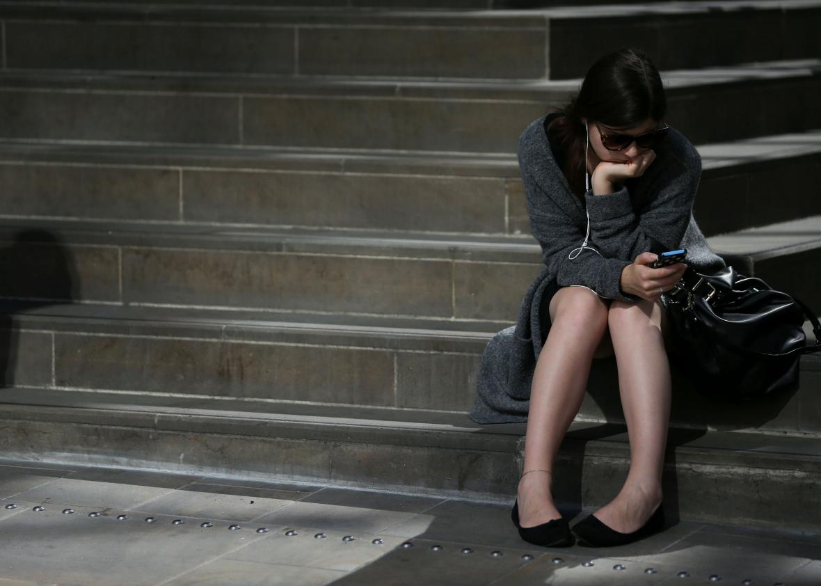 599930926-rail-commuter-waits-for-a-train-at-victoria-station-in